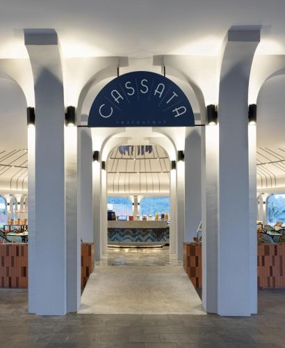 an entrance to a store with a blue sign on the ceiling at Hotel Santika Premiere Linggarjati - Kuningan in Kuningan