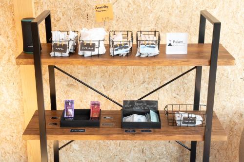 a shelf with books and pamphlets on it at Relam Glamping Resort Gotemba in Gotemba