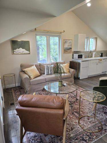 a living room with a couch and a table at Luxury Living in the city in Denver