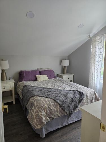 a bedroom with a bed and two night stands at Luxury Living in the city in Denver