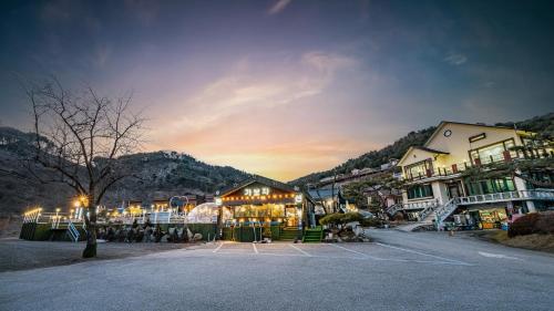 a town with a lot of buildings and a parking lot at Gaboja Private Pet Pool Villa in Gapyeong