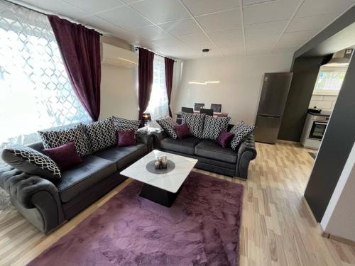 a living room with a couch and a table at Tenno Apartment 3 in Kudjape