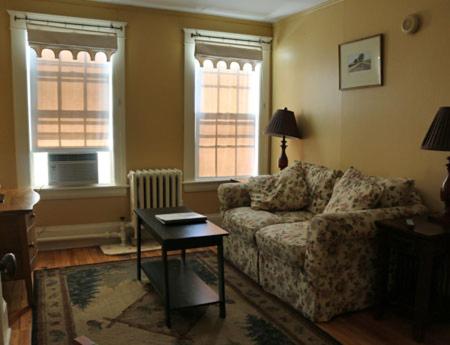 a living room with a couch and a table at Wildcat Inn and Tavern in Jackson