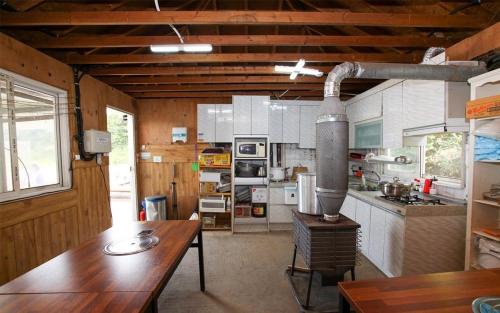 a large kitchen with a table in a room at Taean Anmyeondo Sunset Sea Pension in Taean