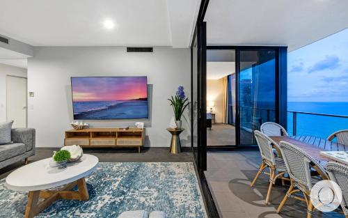 a living room with a view of the ocean at 5 Bedroom Executive Sub Penthouse in the heart of Surfers with full ocean views - Sleeps 12 - Circle on Cavill AMAZING!! in Gold Coast