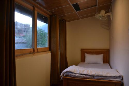 Postel nebo postele na pokoji v ubytování West End Lodges