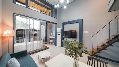 a living room with a couch and a table at Gyeongju Bomun Arno Pet-friendly Pool Villa in Gyeongju