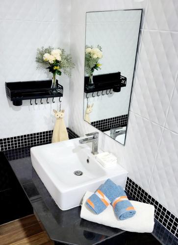 a bathroom with a sink and a mirror at Peaceful Pool Villa 1 in Ao Nang Beach