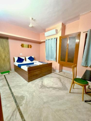 Postel nebo postele na pokoji v ubytování Ratna's Nest Homestay
