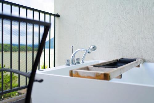 a bathroom sink with a view of the ocean at Yeosu Bokja Pension in Yeosu