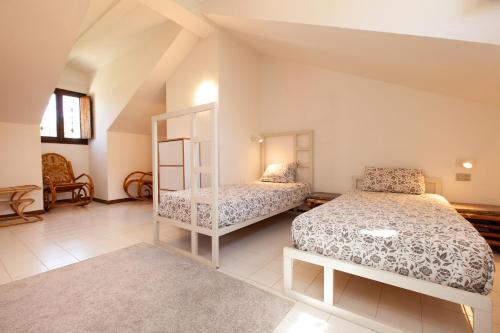 a bedroom with two beds in a room at Villa Acquario in Torre delle Stelle