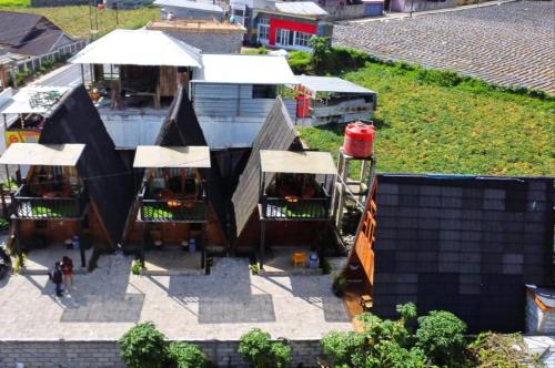 an overhead view of a building with a playground at Cabin LEHA LEHE SYARIAH Dieng in Dieng