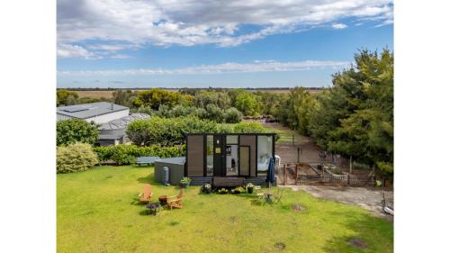 an overhead view of a tiny house on a lawn at Tiny Charm by Tiny Away in Lake Charm