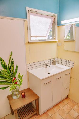 a bathroom with a sink and a window at Mt Bundy Station in Adelaide River