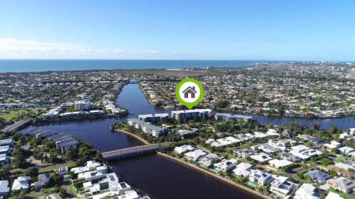 an aerial view of a city with a green sign at Broadwater on the Peninsula in Kawana Waters