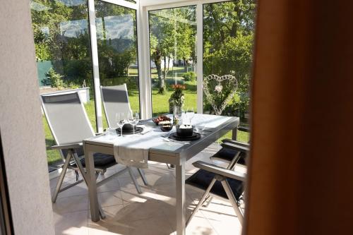 a white table and chairs on a patio at Landhaus Fliederweg in Völkermarkt