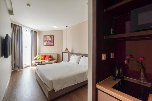 Cama o camas de una habitación en Nguyên Vũ Apec Mũi Né Mandala