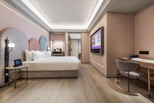 Katil atau katil-katil dalam bilik di Mercure Ningbo Yinzhou