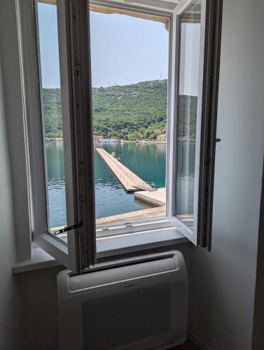 a window with a view of a body of water at Apartment Nina in Bakar