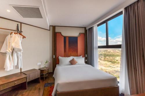 Cama o camas de una habitación en Nguyên Vũ Apec Mũi Né Mandala