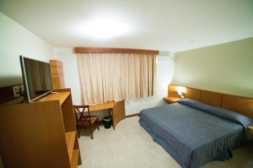Кровать или кровати в номере Copas Executive Hotel