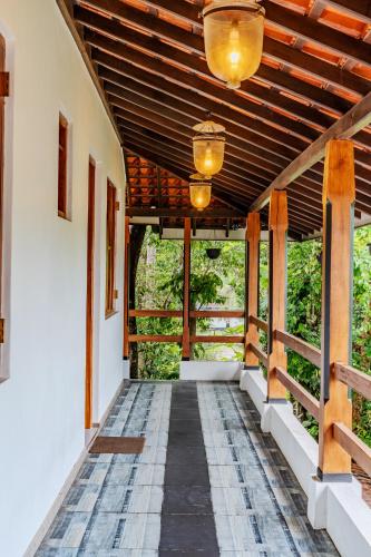 a hallway of a house with a wooden ceiling at Artisan By Sebu in Galle