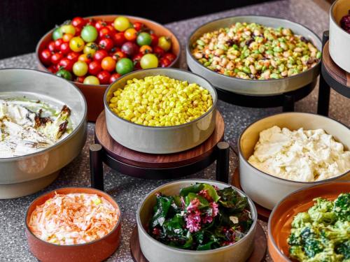 a group of bowls filled with different types of food at Royal Pines Hotel Chiba- Opening in Jan 2025 in Chiba