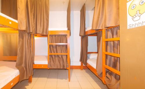a dorm room with bunk beds in it at Stay Malate Hostel by RedDoorz in Manila