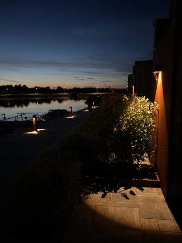 a view of a body of water at night at Varvet Sea View Suites by Ålandhotels in Mariehamn