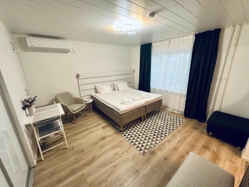 Postel nebo postele na pokoji v ubytování Katariina Apartments