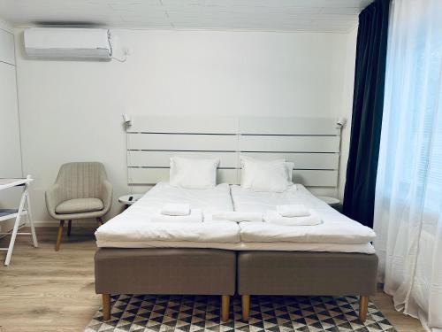Postel nebo postele na pokoji v ubytování Katariina Apartments