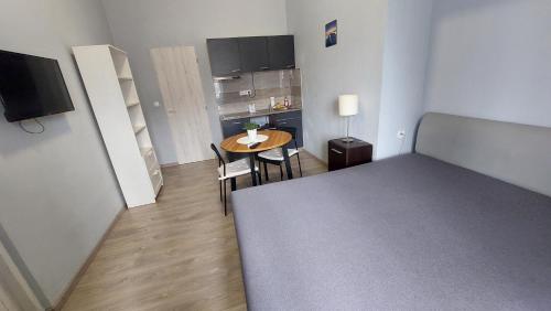 Cama o camas de una habitación en Kinizsi Udvar Apartmanház