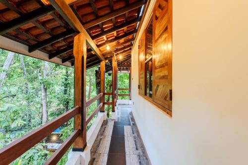 an external view of a house with wooden ceilings at Artisan By Sebu in Galle