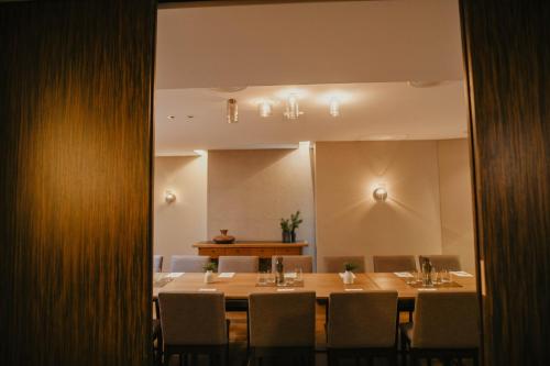 a dining room with a table and chairs at SPA VILNIUS Anykščiai in Anykščiai