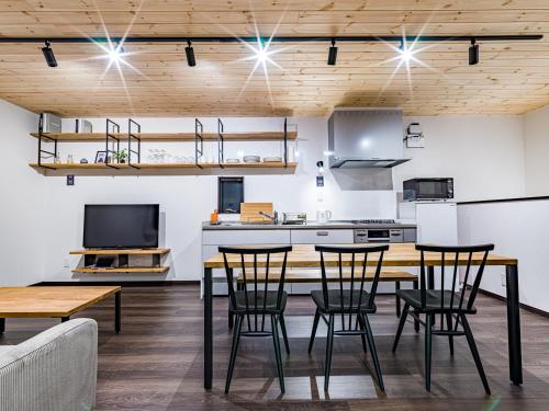 a kitchen and dining room with a table and chairs at Rakuten STAY HOUSE x WILL STYLE Sasebo in Sasebo