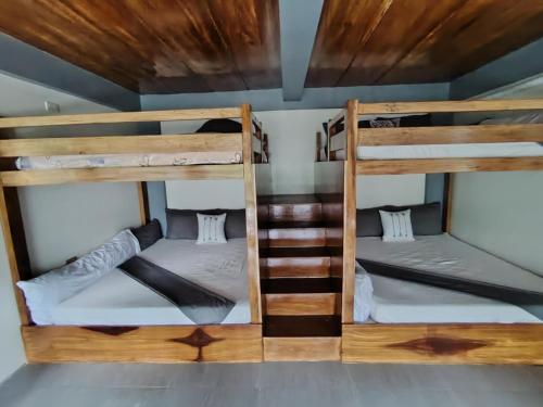 a room with two bunk beds in a house at E - House VILLA Kristina in Lobo