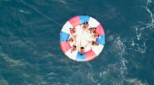 a group of people on a beach ball in the water at E - House VILLA Kristina in Lobo