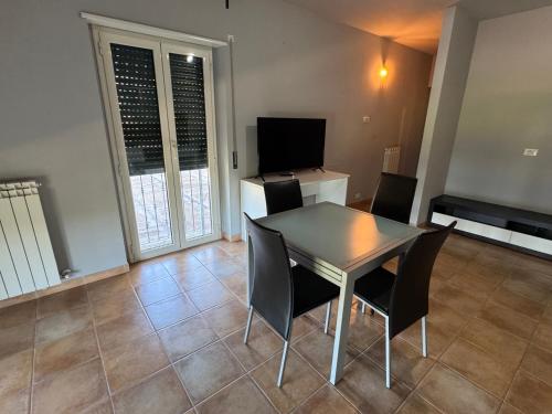 a dining room with a table and chairs at LPH - Dannunziano Country House in Chieti