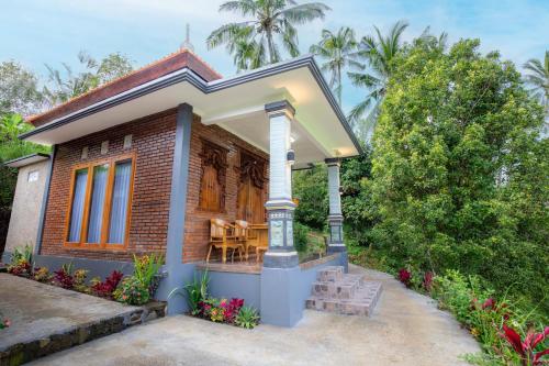 a small house with a porch at The Sekumpul Villa in Sudaji