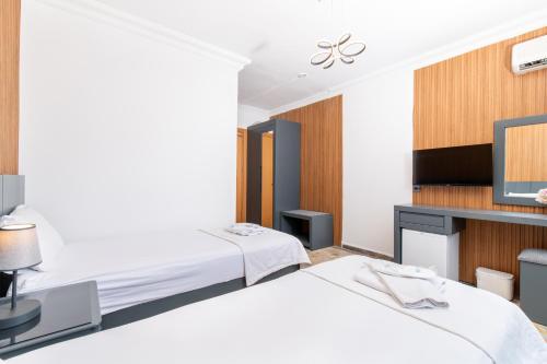 Katil atau katil-katil dalam bilik di Kelebek Hotel