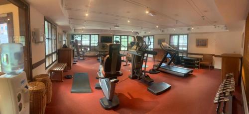 a gym with treadmills and exercise equipment in a building at 812 Manoir Savoie in Bourg-Saint-Maurice