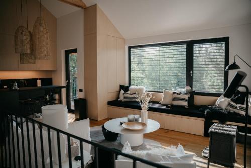 a living room with a couch and a table at Chata Lipinka in Strážnice
