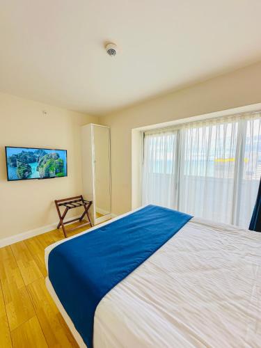Ένα ή περισσότερα κρεβάτια σε δωμάτιο στο Batumi VIP hotel