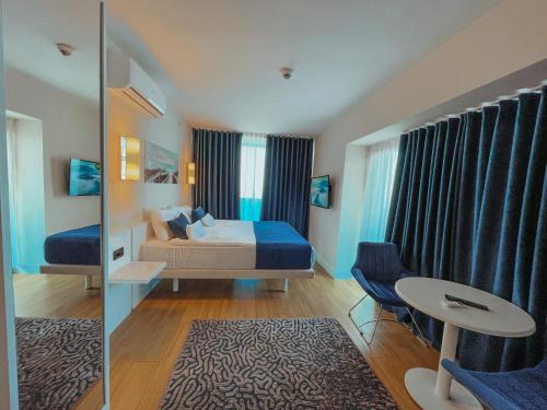 Ένα ή περισσότερα κρεβάτια σε δωμάτιο στο Batumi VIP hotel