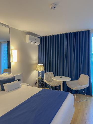 Ένα ή περισσότερα κρεβάτια σε δωμάτιο στο Batumi VIP hotel