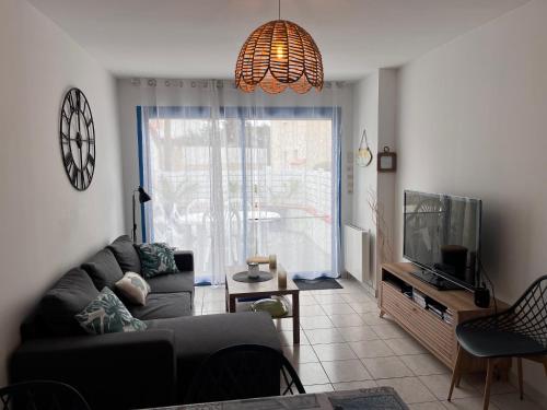 Posedenie v ubytovaní Maison avec grande terrasse à 100m de la plage