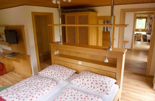 a bedroom with two beds in a room at Pension Trillerhof in Ramsau am Dachstein