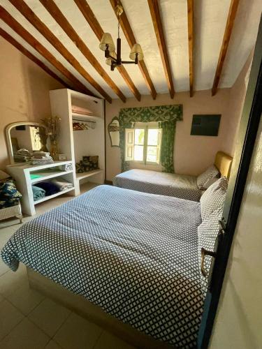 Ένα ή περισσότερα κρεβάτια σε δωμάτιο στο Casa Rural Ubeda - B&B - Pinoso-Alicante