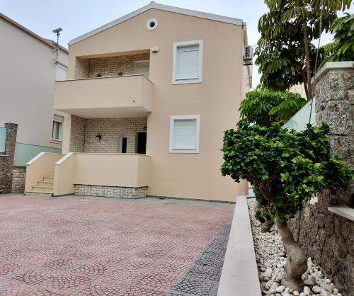 a house with a driveway in front of it at Villa Beata in Perama