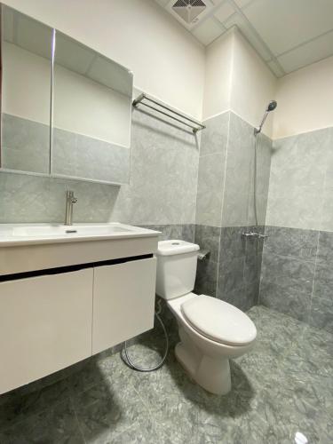 a bathroom with a toilet and a sink and a shower at Colline' House In Phan Rang in Kinh Dinh